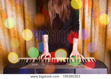 Unrecognizible Girl Musician Playing On Electronic Piano