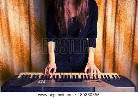 Unrecognizible Girl Musician Playing On Electronic Piano