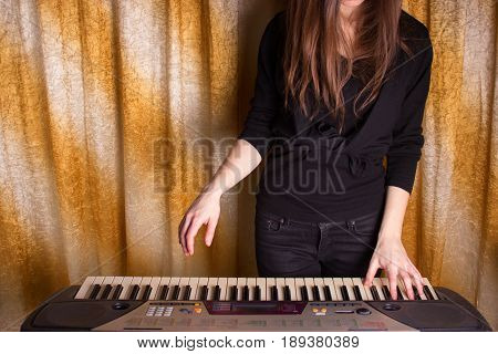 Unrecognizible Girl Musician Playing On Electronic Piano