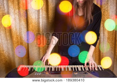 Unrecognizible Girl Musician Playing On Electronic Piano