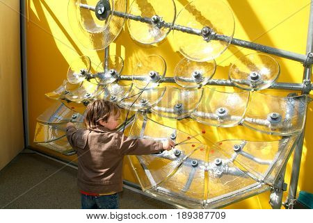 Child Making Music With Glasses
