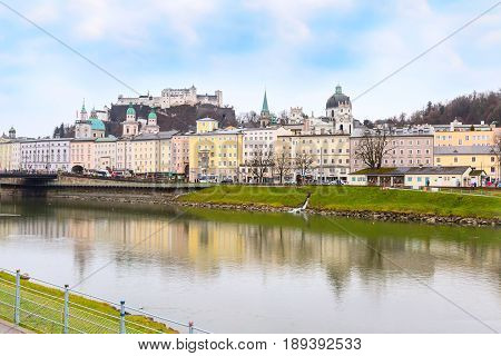 Salzburg, Austria - December 25, 2016: Historic city of Salzburg with Cathedral and Hohensalzburg Festung castle across Salzach river