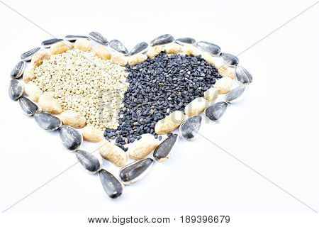 Heart made up of seeds of chia sesamo quinoa mani sunflower and others.