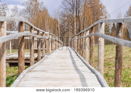 Wooden bridge pathway through the forest in galicia spain
