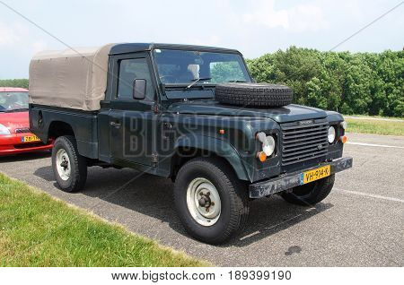 Almere Poort, Flevoland, The Netherlands - June 3, 2017: Land Rover 110 Defender 4C Diesel parked by the side of the road in the city of Almere. nobody in the vehicle