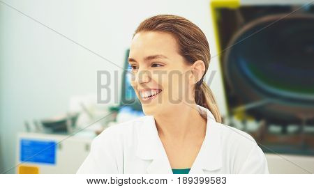 Woman in lab with alb, researcher, doctor, smile