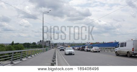 Rostov-on-Don Russia - May 282017: According Voroshilovsky bridge moving cars and pedestrians