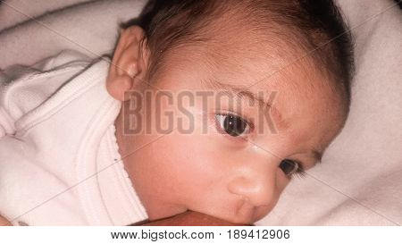 two months old happy  baby boy breastfeeding happy