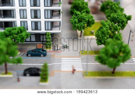 Miniature model, miniature toy buildings, cars and people. City maquette