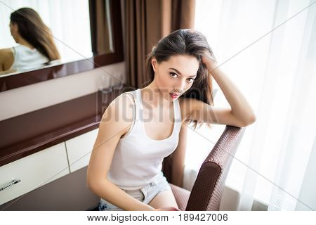Beautiful Sexy Woman Sitting On Chair And Relaxing.