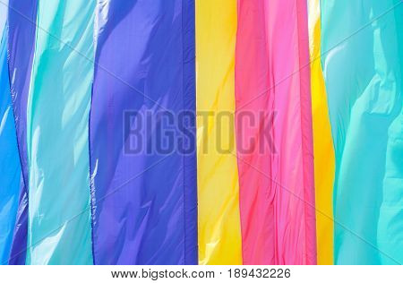 Colorful Beautiful Abstract Background of multicolored flags. Varicolored Holiday Wallpaper. Horizontal Image With Copy Space