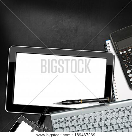 Office desk with a blank digital tablet computer keyboard pencil calculator drawing compass and smartphone. On a Blackboard with copy space