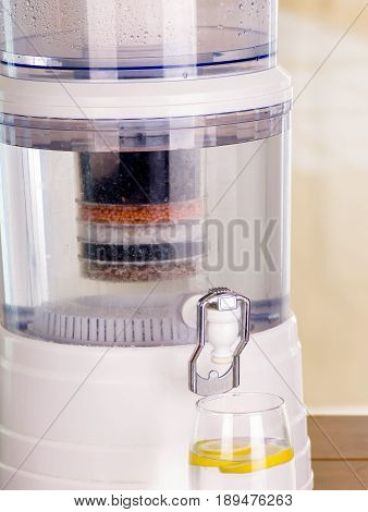 Close up of a filter system of water purifier on a kitchen background.