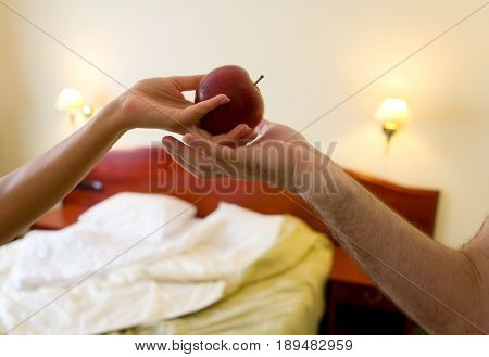 Seduction of a man by a woman. Proposal to taste the forbidden fruit.