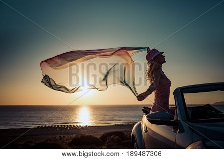 Silhouette Of Young Woman At The Beach