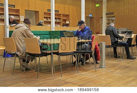 Malmo Sweden - April 22 2017: people are reading in public library in Malme Sweden