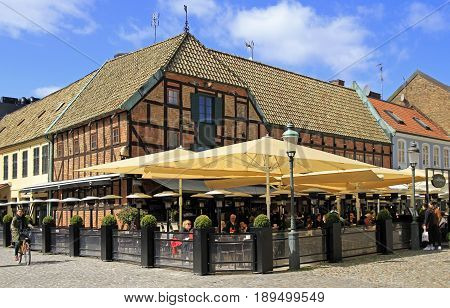 People Are Eating In Cafe Located At Medieval House On The Market Place Lilla Torg