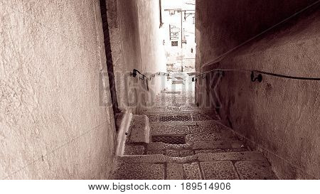 Descending the steep steps in an ancient Italian village during the vacation