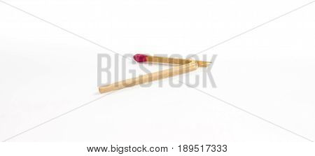One broken match with rose match head isolated on white background