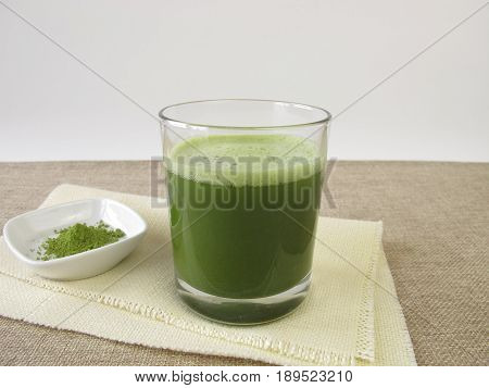 Drinking glass with superfood matcha green tea