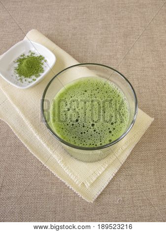 Drinking glass with superfood matcha green tea