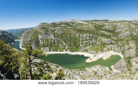 Panoramic photo of a Donnell Lake. Lake and a dam are located on Stanislaus river. California, USA