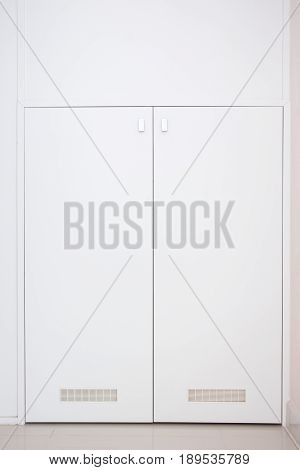White wooden locker doors in the modern house.