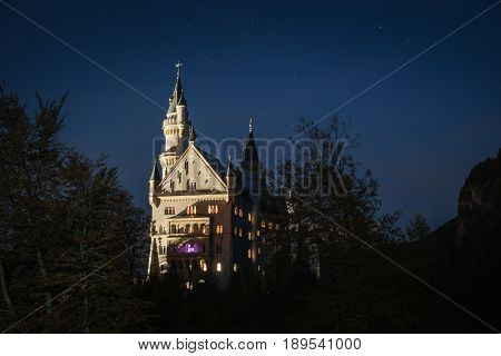 Beautiful view of the Neuschwanstein castle in night. Palace situated in Bavaria Germany. Neuschwanstein is one of the most popular of all palaces and castles in Germany Europe and world.