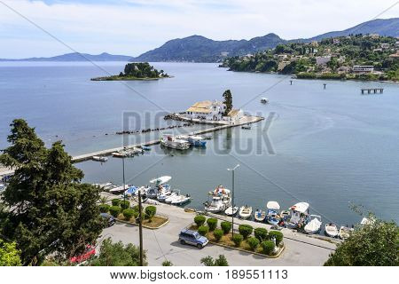 KANONI, GREECE - MAY 15: Vlacherna Monastery seen from the hilltops of Kanoni on May 15, 2017 in Kanoni, Corfu island in Greece.