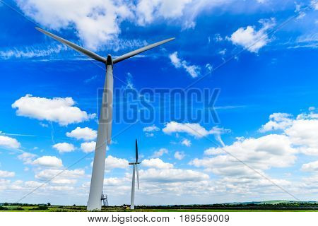 Day view wind power turbines generate electricity.