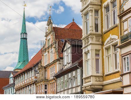 Colorful Facades And Church Tower In The Center Of Hameln