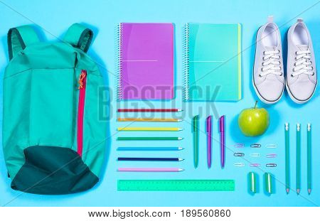 Flat Lay With Various School Supplies On Colorful Surface
