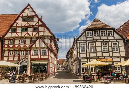 HAMELN, GERMANY - MAY 22, 2017: People enjoying the sun at restaurants on the central square of Hameln, Germany