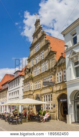 HAMELN, GERMANY - MAY 22, 2017: People enjoying the sun at restaurants on the central square of Hameln, Germany