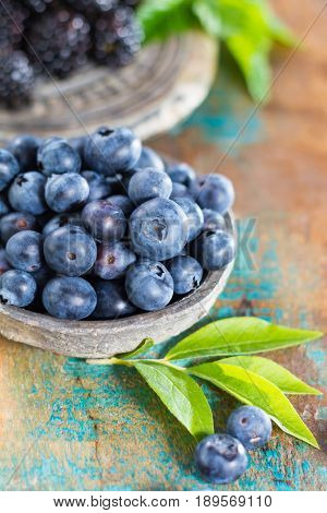 Fresh summer wild blueberries and brambleberry blackberry