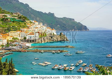 beautiful view of Amalfi town on Amalfi coast with yachts and boats Campania Italy
