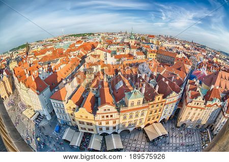 Houses with traditional red roofs in Prague Old Town Square in the Czech Republic. Fish-eye lens.