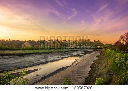 Sunset over the river Rother at low tide, Rye, East Sussex, England