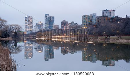 MILWAUKEE WISCONSIN/UNITED STATES - APRIL 1: Most of the cities residents sleep as the sun comes up on the downtown waterfront from Veteran's Park on 03/30/2017 in Milwaukee WI.