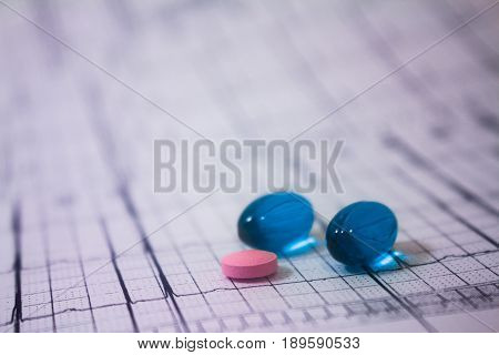Holter electrocardiogram trace of a patient with pacemakers and some colored pills