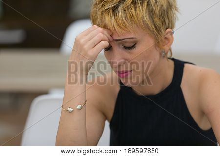 Worried Young Woman With A Tension Headache