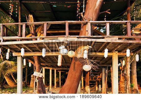Cheap bungalow for backpackers on a tropical beach in evening time. Thailand