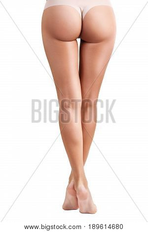 Back view of perfect female legs and buttocks. Healthy and fit legs of young woman. Isolated on white.
