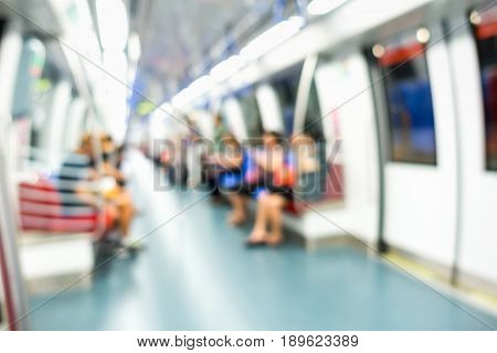 Lifestyle scene in public train. Blurred people.