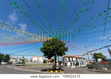 PONTA DELGADA PORTUGAL - SEPTEMBER 10 2016: Garlands street decorations at Madeira Wine Festival in Ponta Delgada Madeira Portugal. The Madeira Wine Festival honors the grape harvest with a celebration of traditional local heritage and wine production.