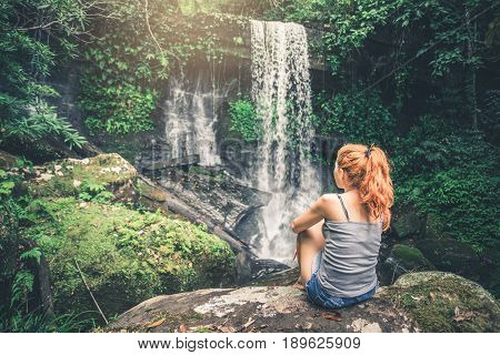 woman asia travelers travel. Walking hand travelers travel nature Forests mountains waterfalls. puhinrongkla romklao-paradorn waterfall