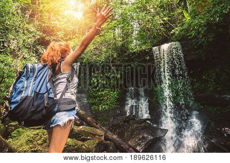 woman asia travelers travel. Walking hand travelers travel nature Forests mountains waterfalls. puhinrongkla romklao-paradorn waterfall