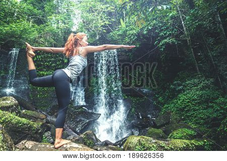 woman asia travelers travel. Walking hand travelers travel nature Forests waterfalls. puhinrongkla romklao-paradorn waterfall. Meditate on yoga