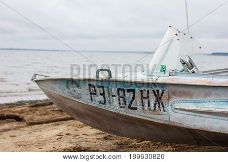 moored boat near the sea in autumn