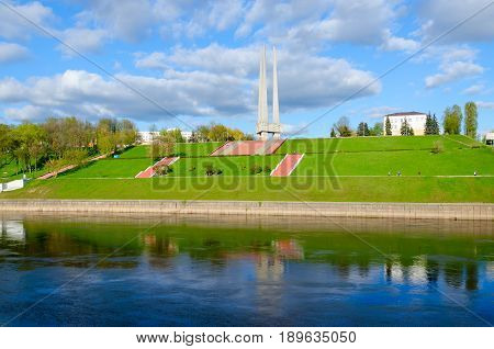 VITEBSK BELARUS - MAY 16 2017: Beautiful view of embankment of Zapadnaya Dvina river and memorial complex in honor of Soviet soldiers-liberators partisans and underground workers of Vitebsk region (